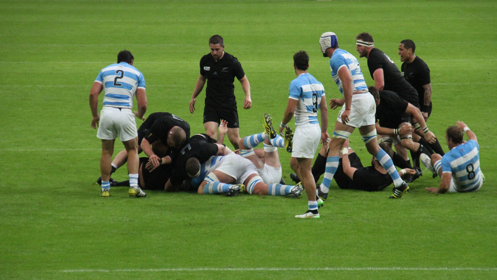 Rugby defenders reorganising around a breakdown during multi-phase defence