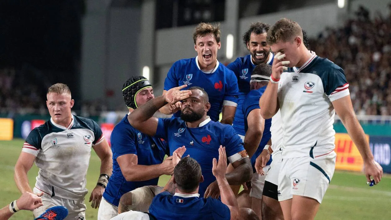 Rugby players contesting possession during an international match