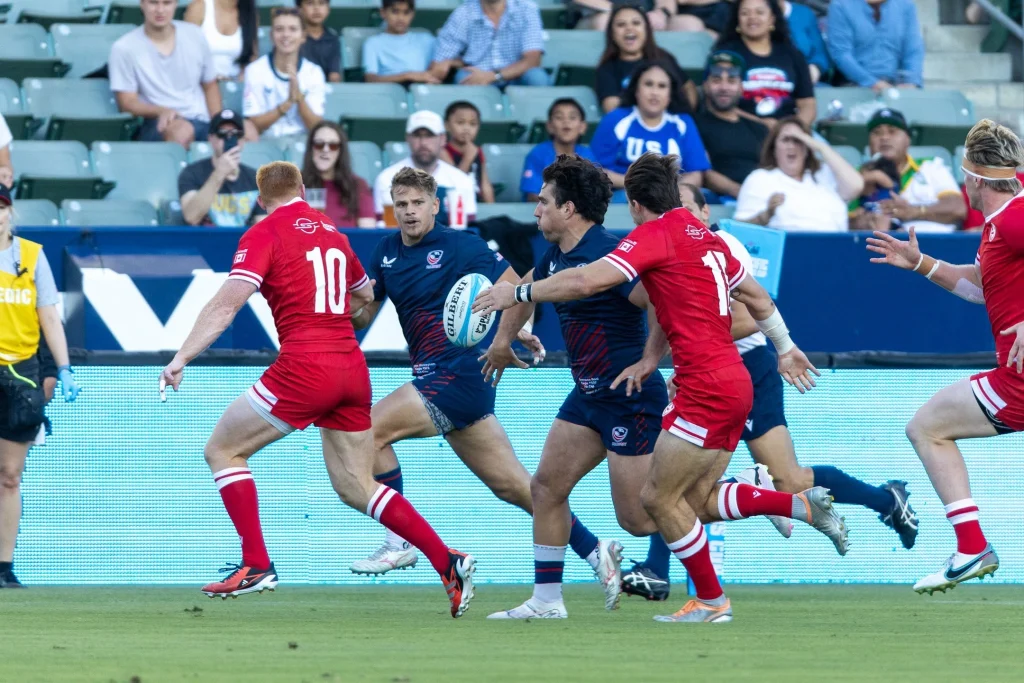 USA rugby ball carrier facing defenders during an international match